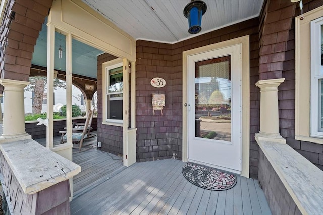 view of exterior entry with a porch