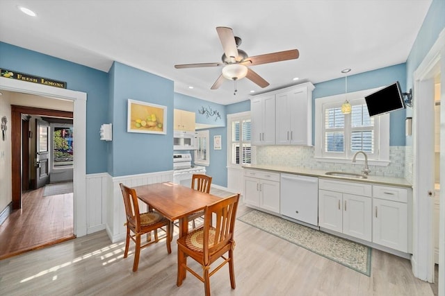 dining area featuring light wood-type flooring, recessed lighting, ceiling fan, and a wealth of natural light