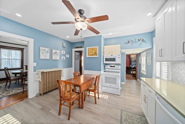 dining area featuring a ceiling fan, recessed lighting, and light wood-type flooring
