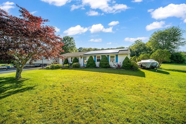 35 Lazywood Ln, Swansea, MA 02777 - ranch-style house featuring a front lawn and roof mounted solar panels