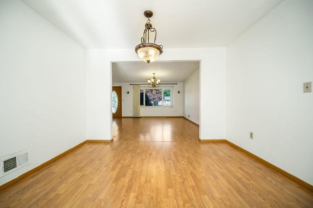 35 Lazywood Ln, Swansea, MA 02777 - empty room featuring a chandelier and light wood finished floors