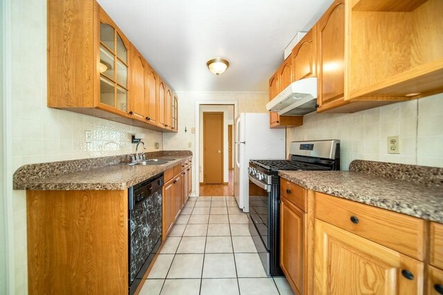 35 Lazywood Ln, Swansea, MA 02777 - kitchen featuring stainless steel gas stove, under cabinet range hood, dishwasher, light tile patterned floors, and decorative backsplash