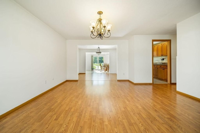35 Lazywood Ln, Swansea, MA 02777 - empty room featuring a chandelier and light wood-type flooring