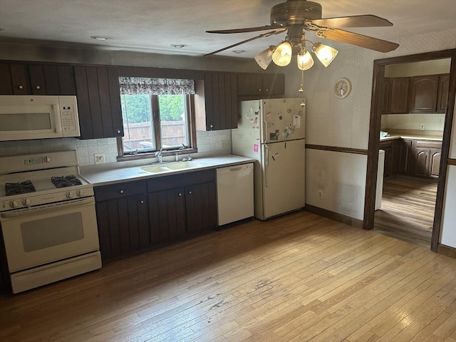 54 Brunswick Park, Melrose, MA 02176 - kitchen with white appliances, light countertops, a sink, light wood-style flooring, and wallpapered walls