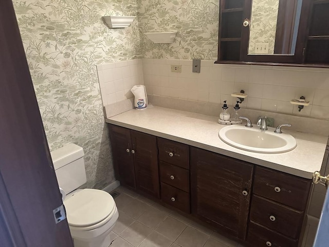 54 Brunswick Park, Melrose, MA 02176 - half bathroom with wallpapered walls, toilet, vanity, and tile patterned flooring
