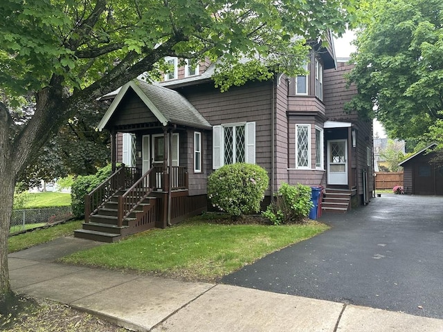54 Brunswick Park, Melrose, MA 02176 - view of front facade featuring an outbuilding and entry steps