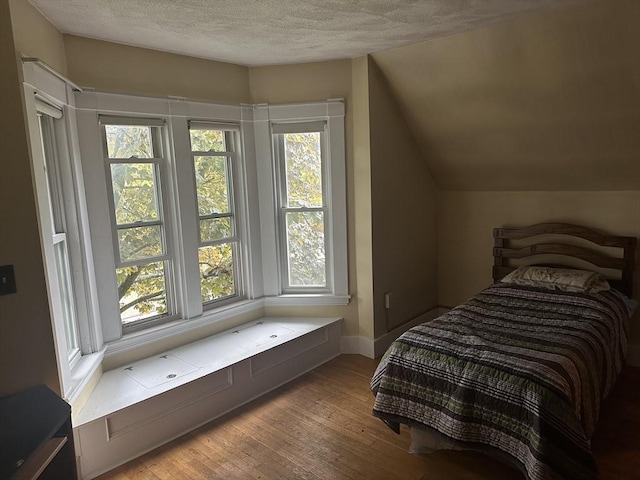 54 Brunswick Park, Melrose, MA 02176 - bedroom with a textured ceiling, wood finished floors, and baseboards