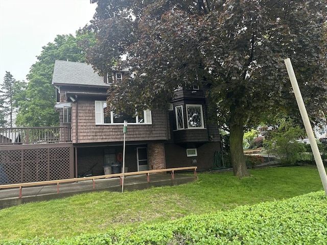 54 Brunswick Park, Melrose, MA 02176 - rear view of house featuring a lawn and a deck