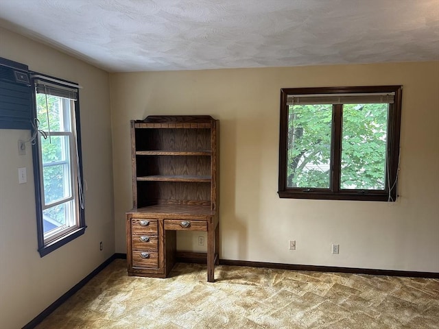 54 Brunswick Park, Melrose, MA 02176 - unfurnished office with plenty of natural light, baseboards, a textured ceiling, and carpet floors