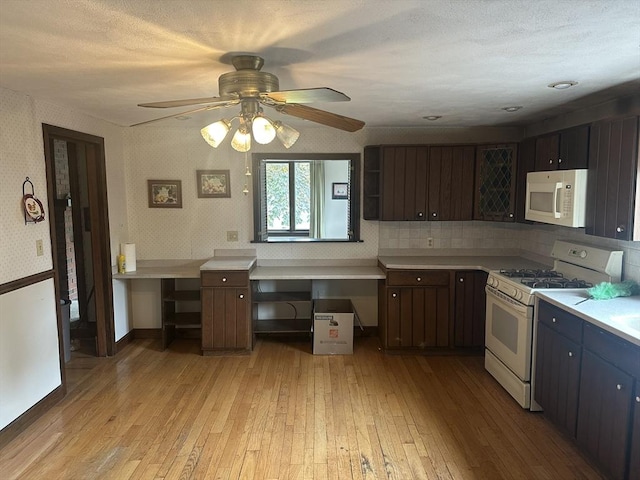 54 Brunswick Park, Melrose, MA 02176 - kitchen featuring white appliances, light wood-style flooring, light countertops, and ceiling fan