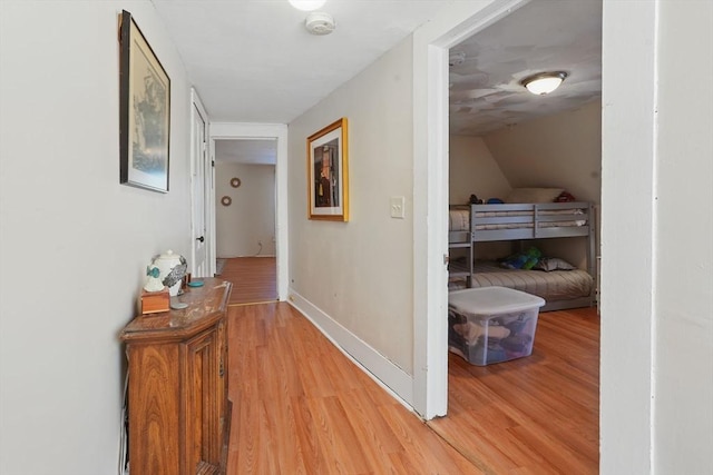 hallway with wood-type flooring