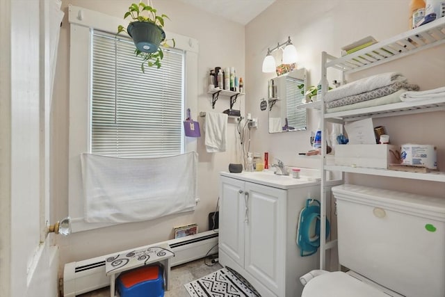 bathroom featuring toilet, a baseboard radiator, and vanity