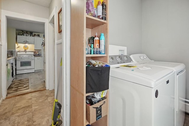 washroom featuring washing machine and clothes dryer