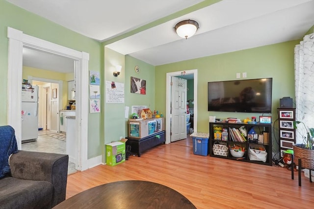 recreation room featuring light wood-type flooring