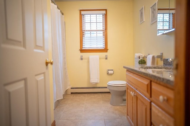 full bathroom featuring baseboard heating, toilet, vanity, tile patterned floors, and a shower with shower curtain