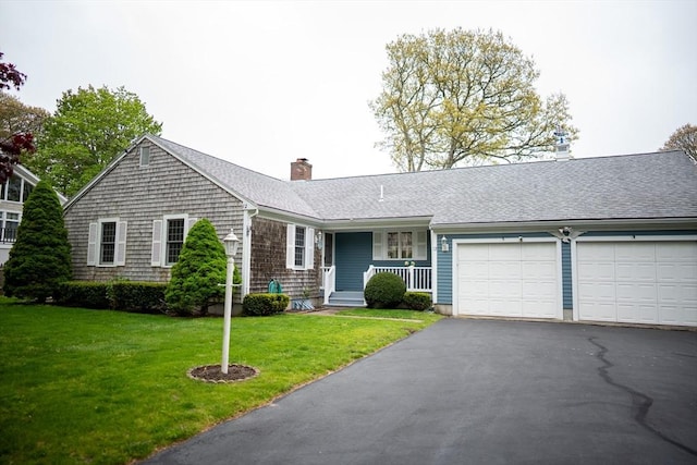 ranch-style home featuring an attached garage, driveway, covered porch, a chimney, and a front lawn