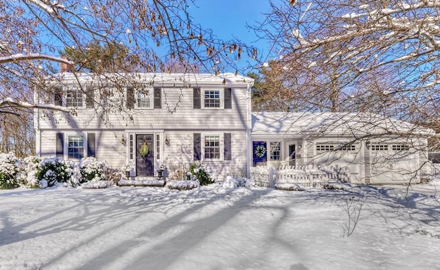 colonial home with a garage