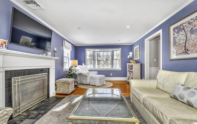 living room featuring a fireplace and ornamental molding