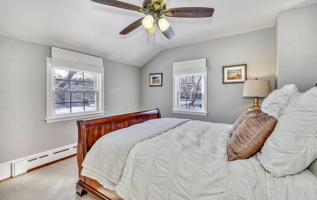 carpeted bedroom featuring multiple windows, a baseboard heating unit, vaulted ceiling, and ceiling fan