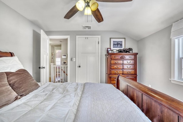 bedroom with lofted ceiling and ceiling fan