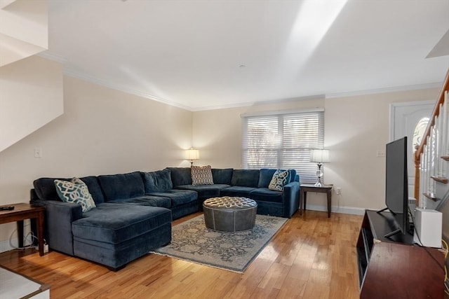 living room with hardwood / wood-style flooring and crown molding