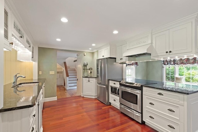 14 Prince St, Danvers, MA 01923 - kitchen featuring stainless steel appliances, custom exhaust hood, a sink, dark wood finished floors, and healthy amount of natural light