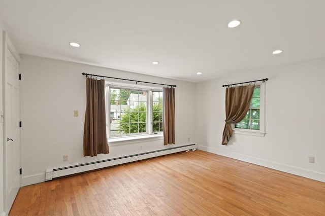 14 Prince St, Danvers, MA 01923 - spare room with a baseboard radiator, wood finished floors, recessed lighting, and baseboards