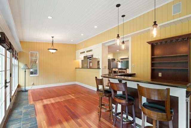 14 Prince St, Danvers, MA 01923 - kitchen featuring freestanding refrigerator, baseboards, dark wood-type flooring, white cabinetry, and dark countertops