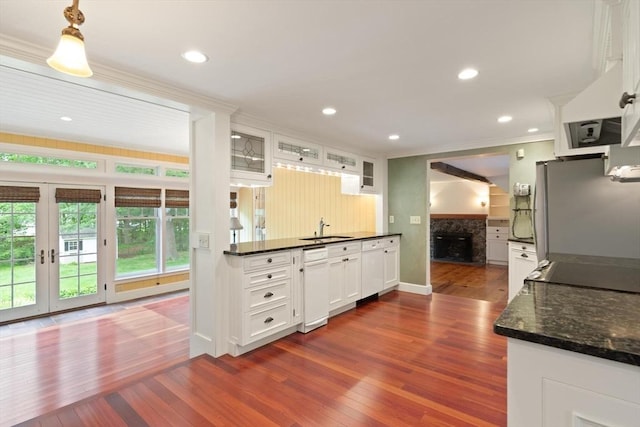 14 Prince St, Danvers, MA 01923 - kitchen featuring a sink, freestanding refrigerator, crown molding, a fireplace, and white cabinetry