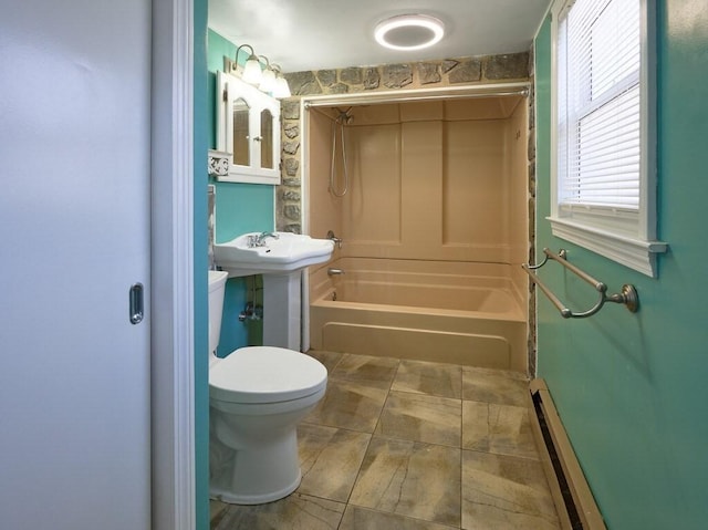 full bathroom with sink, a baseboard radiator, shower / washtub combination, and toilet