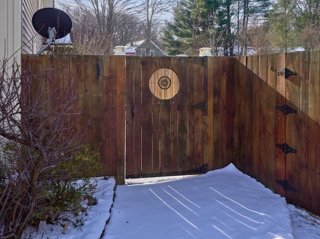 view of snow covered gate