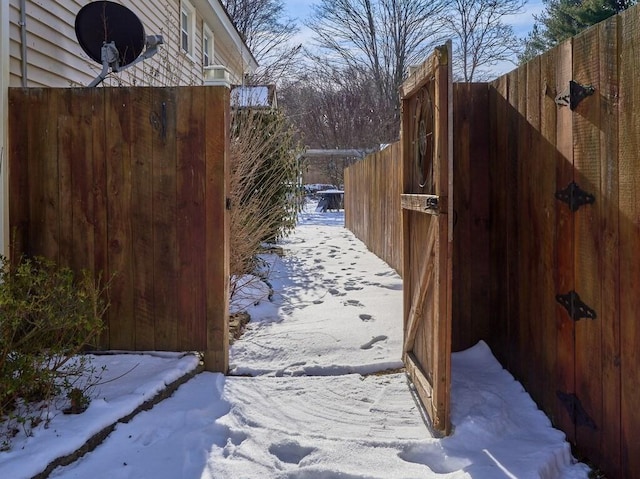 view of snow covered gate