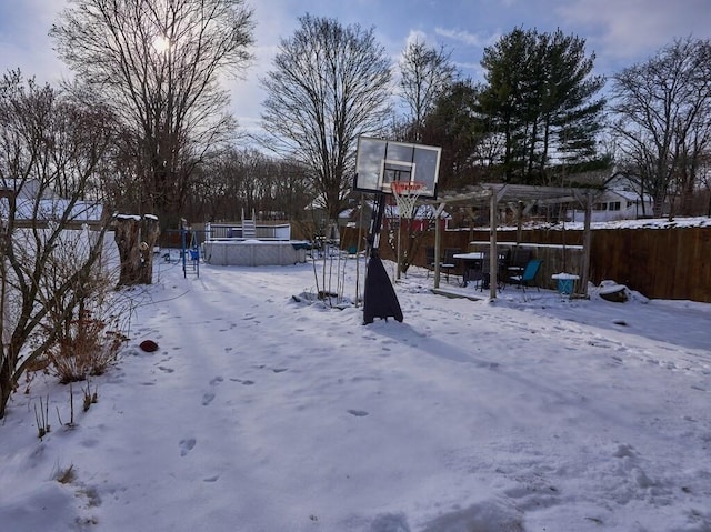 view of yard layered in snow