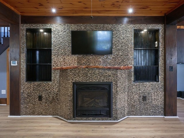 unfurnished living room with wood ceiling and wood-type flooring