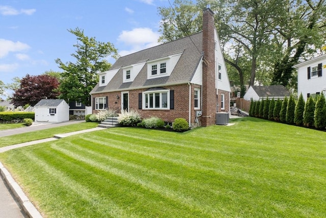 71 Sheffield Rd, Melrose, MA 02176 - colonial inspired home with brick siding, central AC, a chimney, and roof with shingles