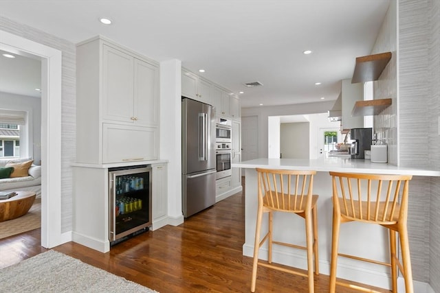 71 Sheffield Rd, Melrose, MA 02176 - kitchen featuring beverage cooler, appliances with stainless steel finishes, open shelves, dark wood-style flooring, and recessed lighting