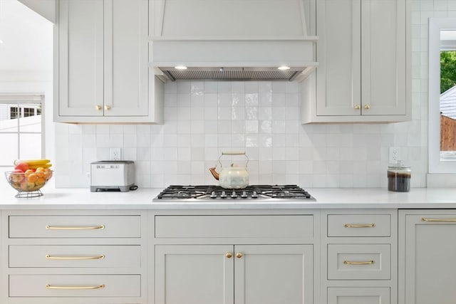 71 Sheffield Rd, Melrose, MA 02176 - kitchen with wall chimney range hood, light countertops, and backsplash