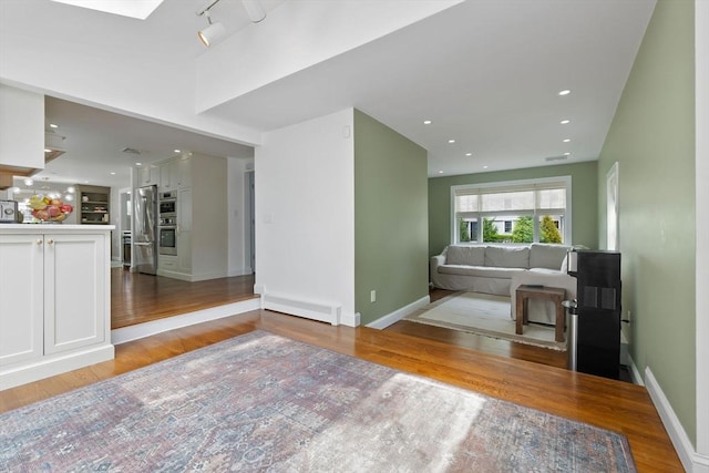 71 Sheffield Rd, Melrose, MA 02176 - living room featuring light wood-type flooring and baseboards