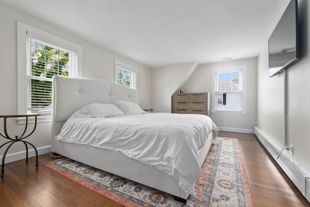 71 Sheffield Rd, Melrose, MA 02176 - bedroom featuring multiple windows, wood finished floors, and baseboards