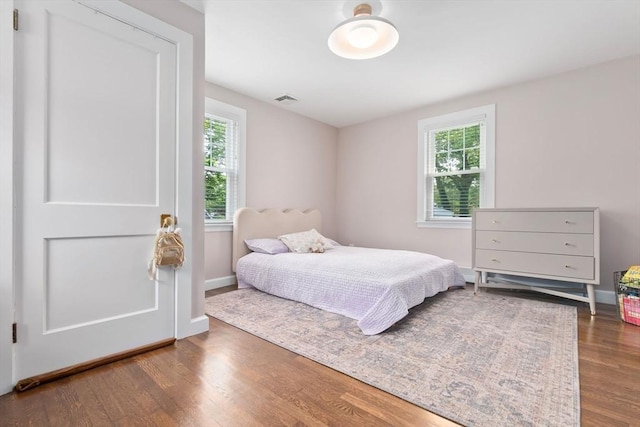 71 Sheffield Rd, Melrose, MA 02176 - bedroom featuring multiple windows, wood finished floors, and baseboards