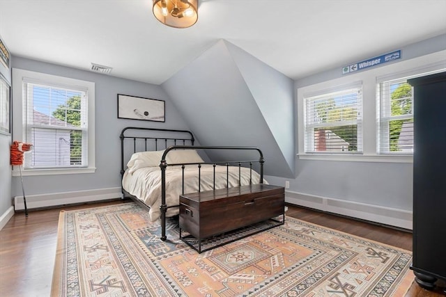 71 Sheffield Rd, Melrose, MA 02176 - bedroom with multiple windows, wood finished floors, baseboards, and vaulted ceiling