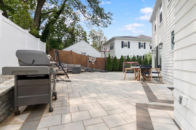 71 Sheffield Rd, Melrose, MA 02176 - fenced backyard with an outdoor living space, a patio, outdoor dining space, and area for grilling