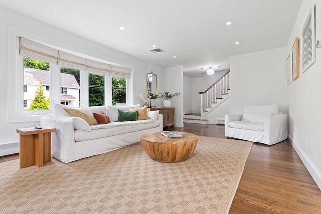 71 Sheffield Rd, Melrose, MA 02176 - living area featuring wood finished floors, stairway, baseboards, and recessed lighting