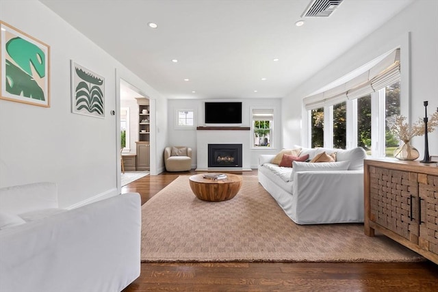 71 Sheffield Rd, Melrose, MA 02176 - living room featuring recessed lighting, wood finished floors, and a fireplace