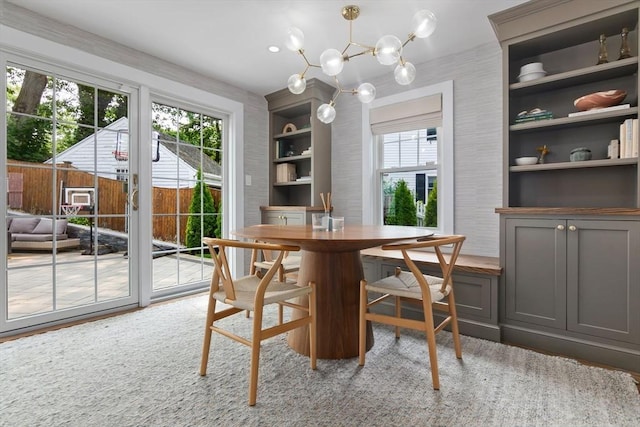 71 Sheffield Rd, Melrose, MA 02176 - dining space with a chandelier, built in features, and wood finished floors