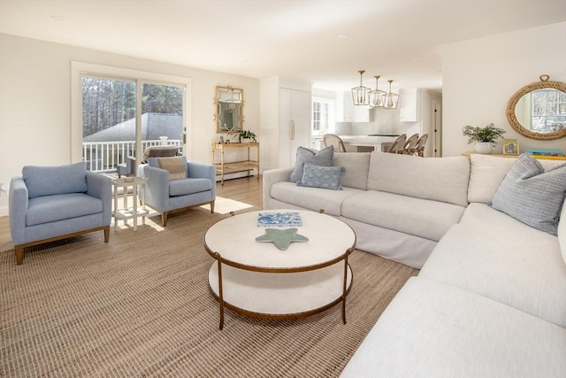 living area featuring a chandelier