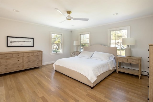 bedroom with crown molding, multiple windows, and light wood-style floors