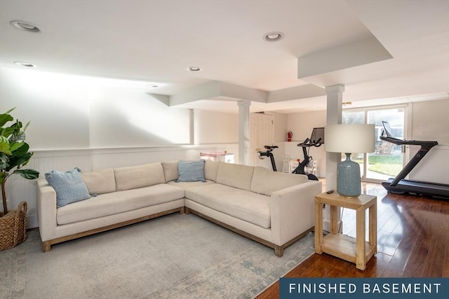 living room with wainscoting, recessed lighting, decorative columns, and hardwood / wood-style flooring