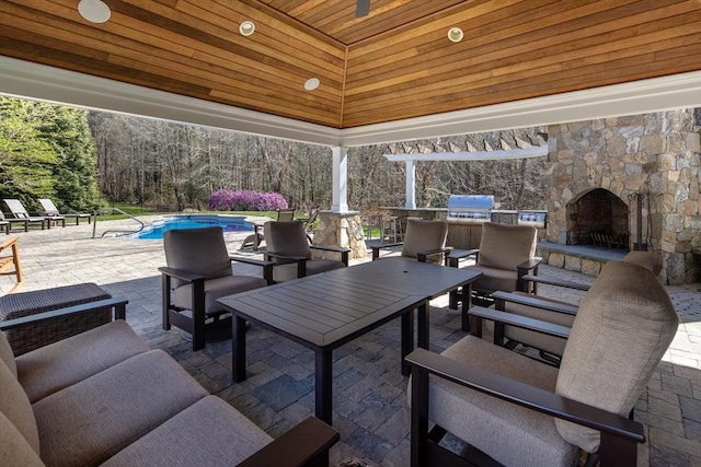 view of patio / terrace featuring area for grilling, a gazebo, an outdoor living space, and an outdoor pool