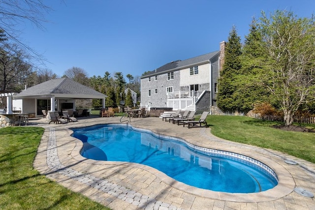 pool with a lawn, a patio, a gazebo, and stairway